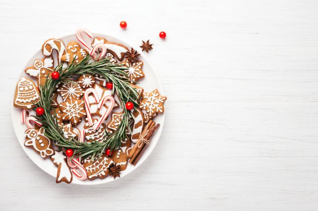 white plate with gingerbread cookies and candy canes