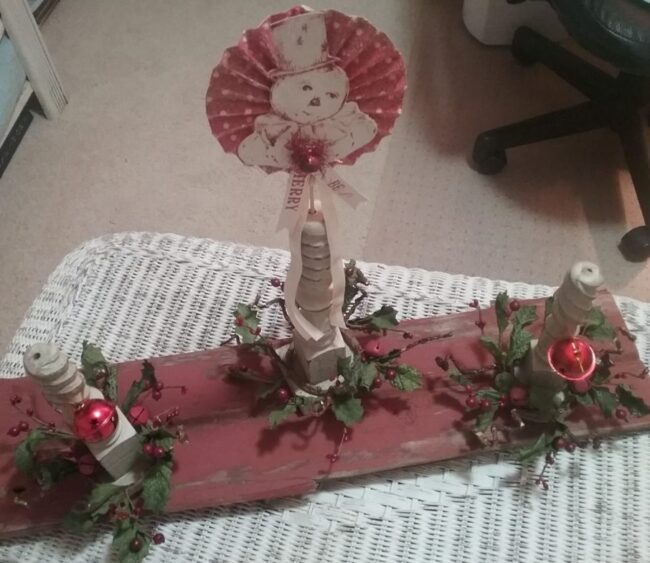 centerpiece with red barnwood, spindles & jingle bells