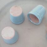 a trio of tiny blue terra cotta pots