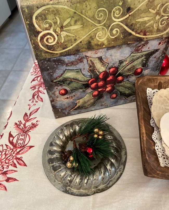 red berrys with greenery in small tin mold