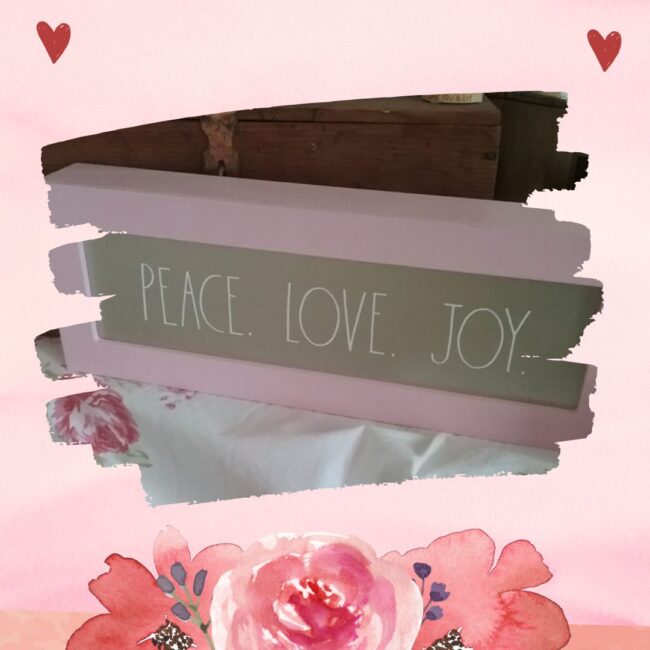 pink framed sign with the words Peace Love Joy