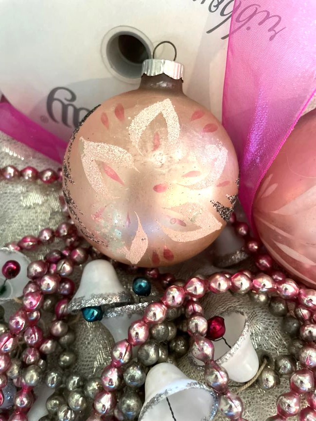 vintage glass ornament with pink ribbon and beaded garland
