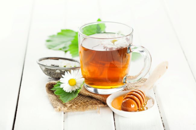 glass mug filled with herb tea