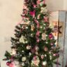 Christmas tree decorated with vintage ornaments, silk flowers, ribbon and beaded garland