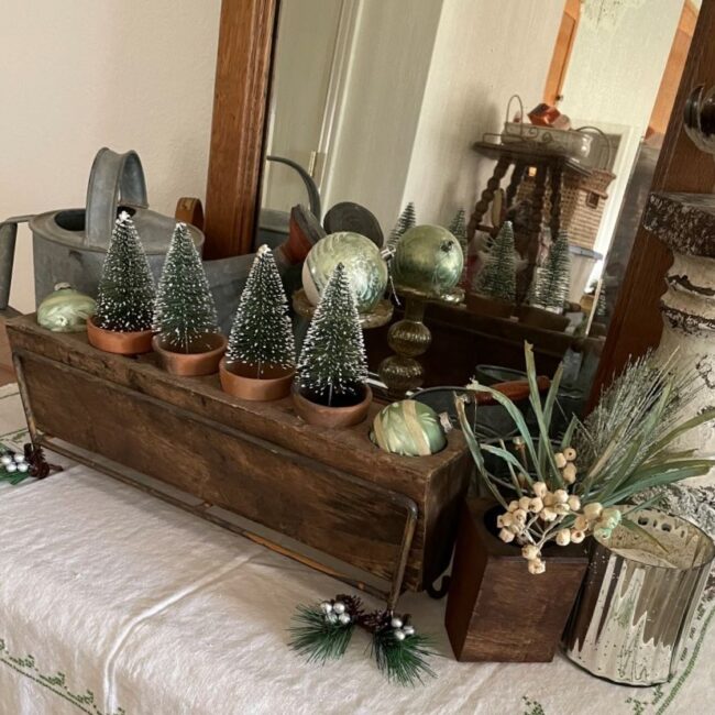 6 hole sugar mold in metal stand with small trees and vintage glass ornaments
