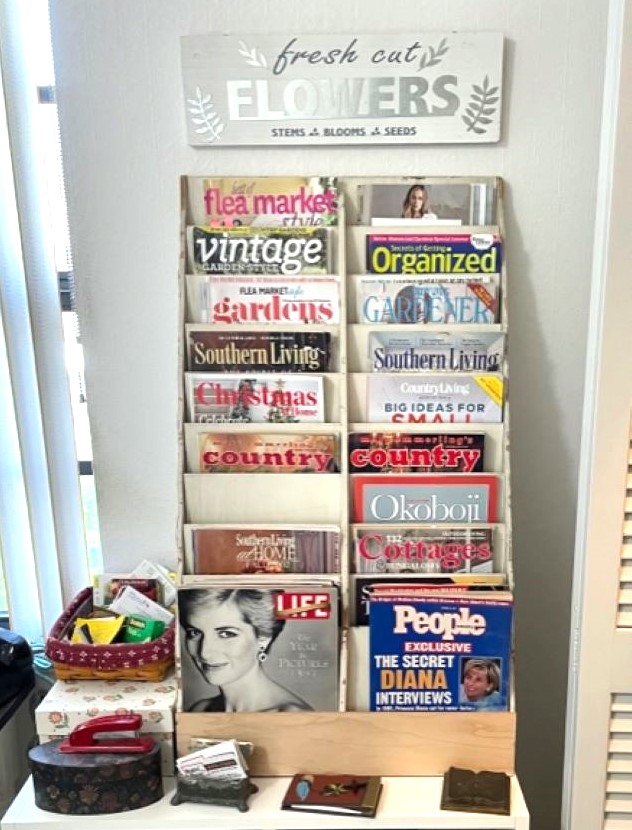 wooden cubby holding assorted magazines