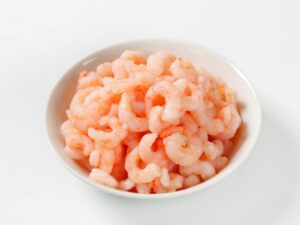 white bowl full of small shrimp