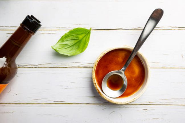 small bowl with worcestershire sauce and a spoon