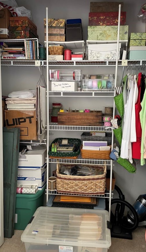 bedroom closet doubling as office/craft room storage