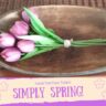 oval wooden bowl with a bouquet of faux purple tulips