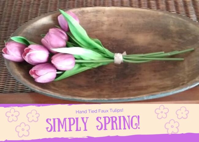 oval wooden bowl with a bouquet of faux purple tulips