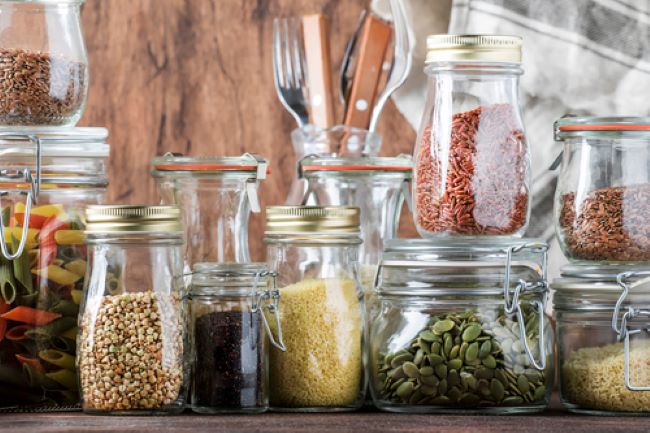 dried beans, pasta and rice stored in glass jars