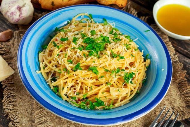 bowl of spaghetti tossed with garlic & oil
