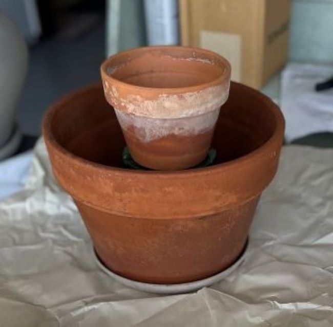 two terra cotta pots ready to plant