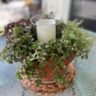 Simple Summer Succulent centerpiece with a hurricane made from recycled glass