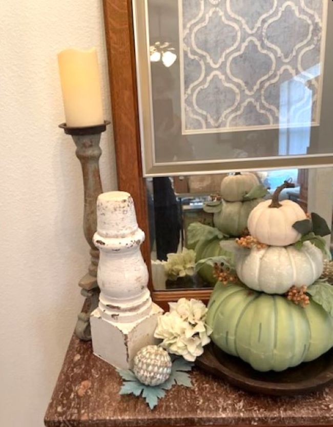 Architectural salvage pillar in a fall vignette with a pumpkin topiary