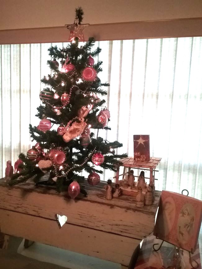 Faux Christmas tree decorated with vintage ornaments