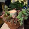 close up photo of succulent centerpiece with snowflake votive holder