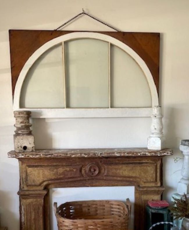 vintage mantel and old window ready to be decorated