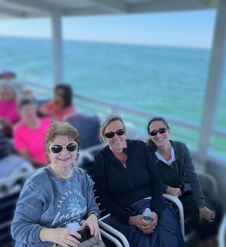 three ladies on a boat