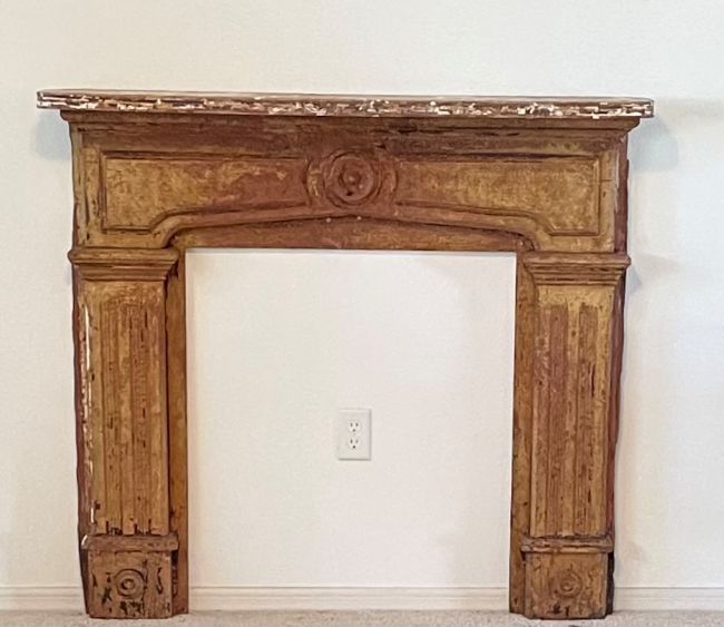 reclaimed fireplace mantel after securing to the wall- ready to decorate