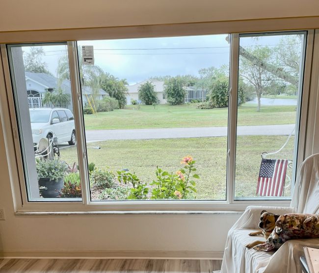 view from inside home looking out to a lake