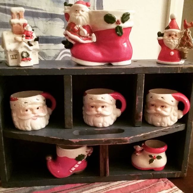 wooden carrier used as a display for vintage Christmas mugs