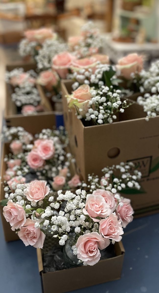 spray roses with baby's breath bud vases, boxed up ready to deliver