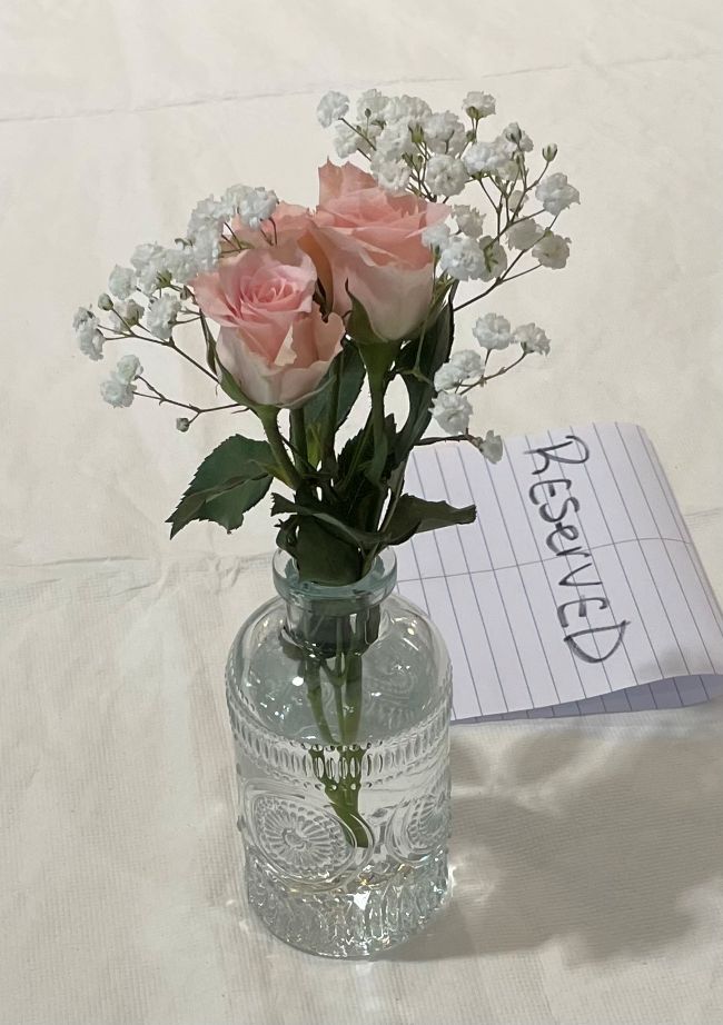 glass vase with pink spray roses & baby's breath
