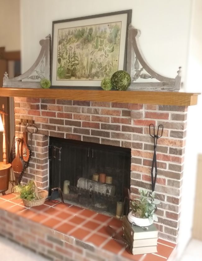 Fireplace mantel decorated with architectural salvage