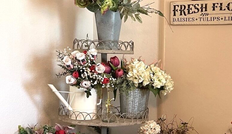 vintage style corner wire rack filled with buckets of faux flowers