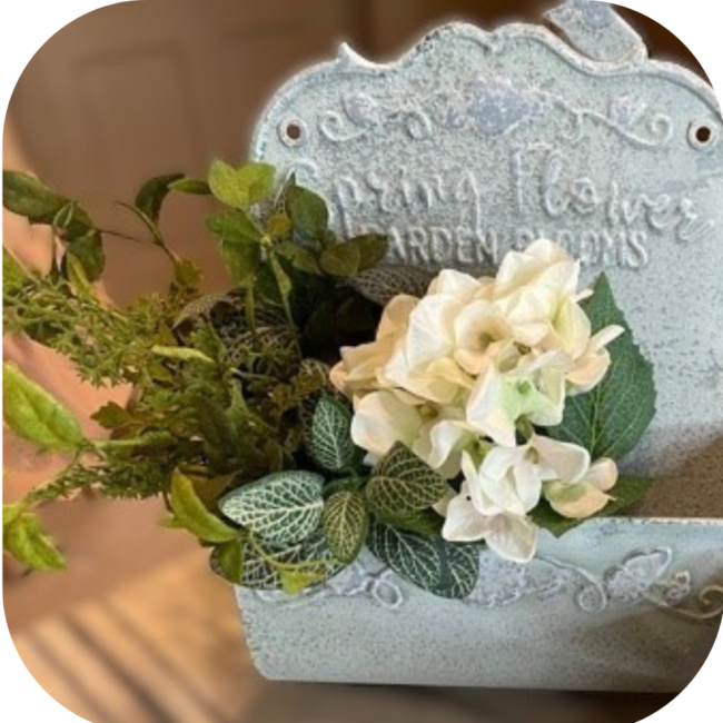 tin wall pocket with Spring Flowers Garden Blooms embossed on it