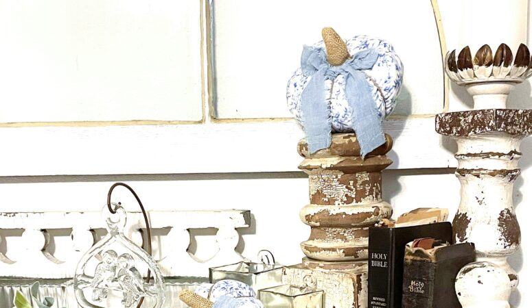 reclaimed fireplace mantel with architectural salvage pieces, heritage bibles, faux florals and soft fabric pumpkins