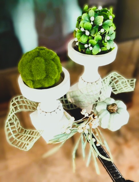 set of two wooden candle holders with moss ball and greenery orb accented with ribbon, tallow berries and faux pumpkin