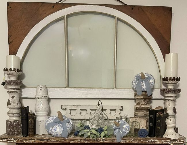 Early Fall mantel display with architectural salvage pieces, vintage bibles and fabric pumpkins