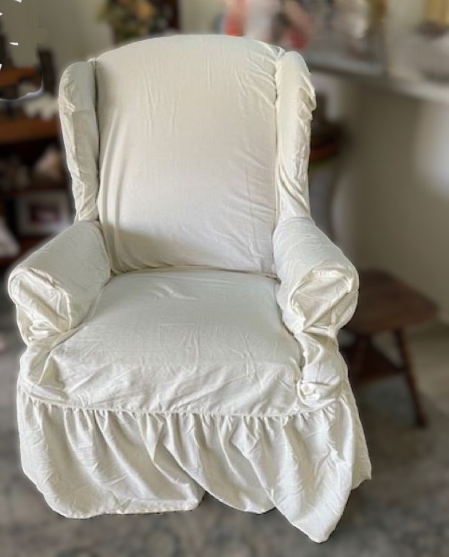 fitted slipcover on an old wingback chair